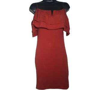 Burnt orange dress sleeves hang off the shoulders